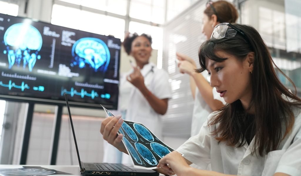 Medical Workplace Healthcare. Multiethnic doctor Team Wearing Medical Masks Having Meeting In Office